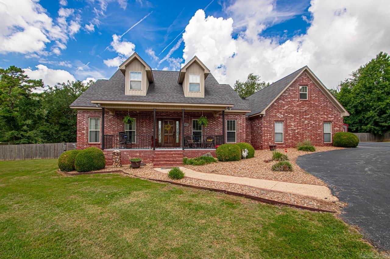 **Country Charmer** This 3 bedroom, 2 full bath home has many extras. The large dining and extra breakfast area plus bar open to the living room will meet all your expectations on having family gatherings with lots of room. This cozy living room with fireplace will keep you feeling right at home. Beautiful hardwood floors in main area. The split bedroom plan is nice for extra privacy. The kitchen has lots of updates including the granite countertops and beautiful backsplash. The walk in pantry will provide ample space and storage. Easy access to half bath from outside. The primary suite is large with lots of windows. The primary bathroom has updated shower and heated floors. Primary walk in closet is also a storm shelter. The bonus room upstairs is great for an additional bedroom or another living area. Nice Front and back porches. Huge yard for garden, etc. 30x30 Shop, with 24x12 w/lien to storage building. 2021 Remodel in Kitchen, Bathrooms and Fireplace. Upstairs HVAC est. 2016, Downstairs HVAC est. 2021. Extra blown insulation in the attic. All west side windows tinted. 2022 est. New roof, whirlybirds, and ridge vents. 2020 new microwave. Both porches painted this year.