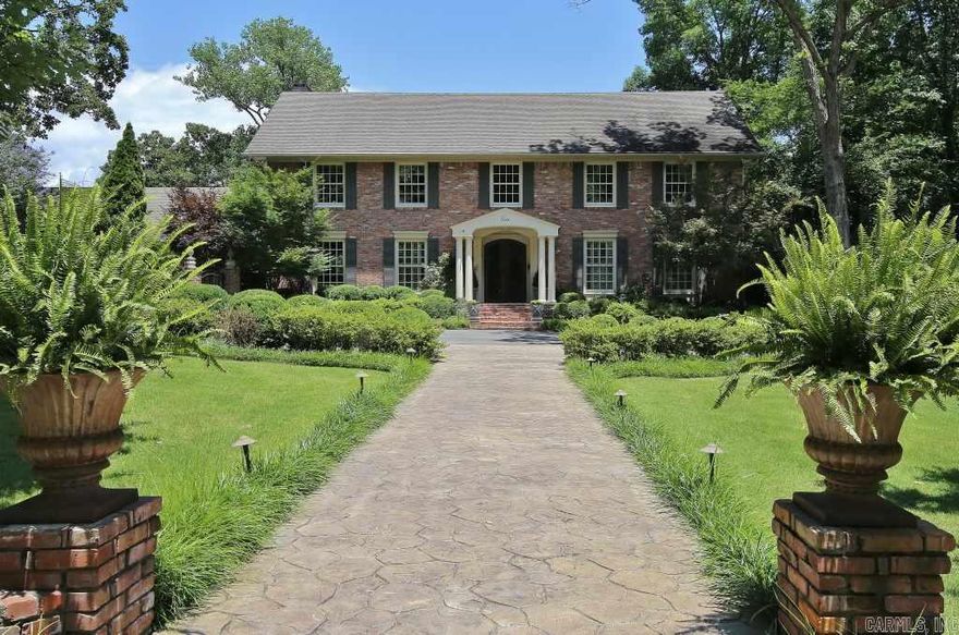 Stunning Georgian on lovely landscaped yard.  House was taken back to studs in 2005, rewired and re-plumbed.  New Pella windows installed. Spectacular 2 story hearth room adjacent to kitchen with Woodmode cabinets.  Spacious master with barrel Vaulted ceiling.  Lovely covered deck with fireplace and hot tub.  Every time you turn around you are looking out to the lush landscaping.  Exclusions - Foyer Chandelier.  Has hardwood floors, house generator, rear loading garage with gate controlled driveway.