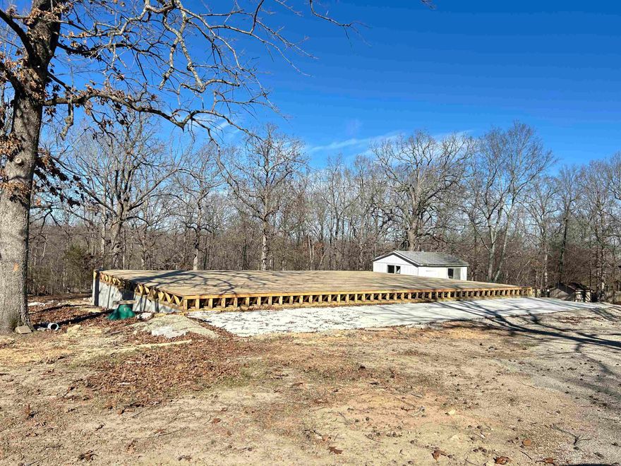 Build your dream home or weekend cabin on this 2-acre lot with a 60x40 foundation completed already, you are ready to build. City water meter and sewer grinder pump on the property. Manufactured homes are allowed.  Minimum square footage is 800 Sq ft. Located on a paved city road. Has a small outbuilding.  Partially fenced.  Several large trees are scattered on the property. Minutes to Hardy and Spring River for swimming, fishing and boating. Minutes to the Harold E. Alexander Wildlife Refuge for hunting.