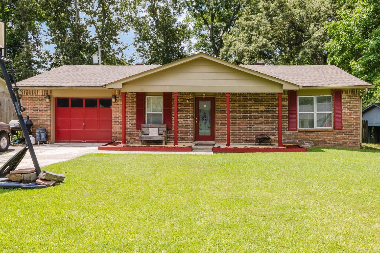 Welcome home to 11 Woodbriar Ct. This charming 3 bedroom 2 bath offers a living room, den with a beautiful fireplace, and eat-in kitchen. The backyard can be enjoyed from the screened in porch, or deck that overlooks the fully-fenced backyard. Updates include NEW ROOF (2025), fresh new paint, updates in both baths, and more.