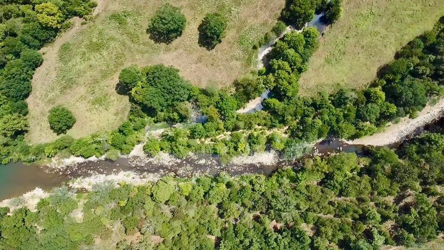 3 Acres on Little Piney Creek.  Rare find! This 3-acre tract offers nearly 300 feet of frontage on Little Piney Creek, elevated for gorgeous views. Mostly wooded with large trees, natural rock steps lead down to the water. Enjoy gated private access, plus a community easement for easy canoe and raft launch. Electric is less than 1,000 feet to the property line. New survey in place. Build your weekend cabin getaway or forever home in this beautiful private setting.