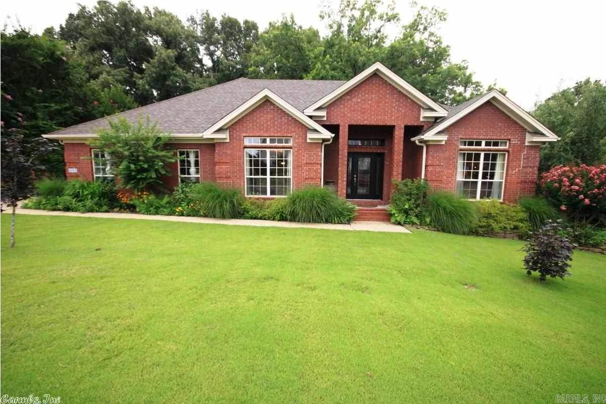 Beautiful custom Brick home conveniently located minutes from the Interstate, schools and shopping in Bryant. Split floor plan with master suite that has tray ceilings, bath with jetted tub & 2 walk-in closets. Lovely entry that opens into living area with hardwoods, tray ceiling and gas fireplace. FD with chandelier, hardwoods & designer wall paper. Kitchen has black appliances, oak cabinets, breakfast bar, hardwoods & breakfast area. Large deck. Shed/workshop is 12x16, electricity with heat/ac.