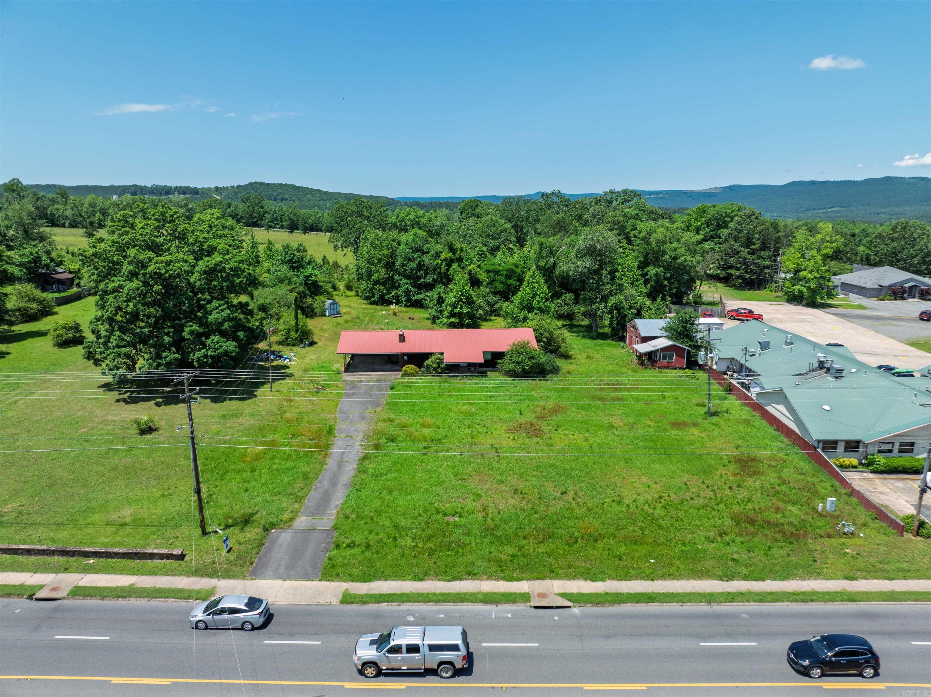 This 1.41 acre lot directly located on Hwy 65 S is minutes from the Clinton Walmart Supercenter and boasts a 14,000+ daily traffic count! This property has a ton of potential for numerous business ventures with high visibility in an ever growing city! Close proximity to Greers Ferry lake grows the potential for cabins, hotels, an RV park, ice machine, and so many more revenue producing ventures!