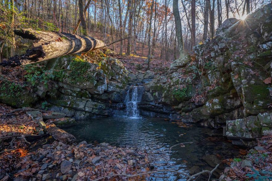 One of a kind opportunity to build your dream home on over 3 acres of seclusion & privacy in the heart of Little Rock! Property is bordered by a long beautiful creek and includes the waterfall that lies right before the gates to Greathouse Bend Estates. Beautiful views of a second waterfall from the back of the property atop a large rocky bluff. Conveniently located a half mile from the Big Dam Bridge, and just 8 minutes from dining/shopping in the Heights. Property can be subdivided, and has multiple build sites.