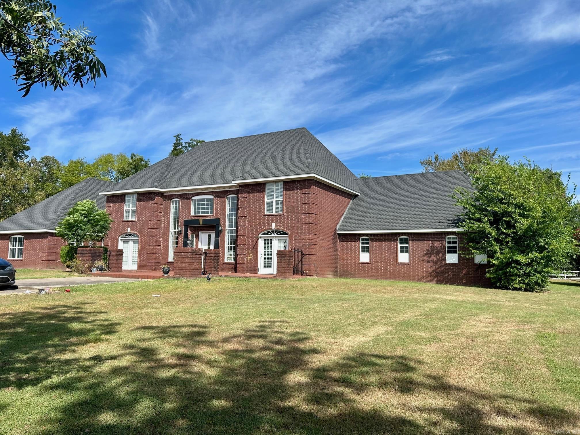 A RARE FIND!! OVER 5,000 SQ. FEET OF A CUSTOM BUILT, CONTEMPORARY ESTATE HOME on 2.55 acres! along with 2 guest houses with individual garages adding over 1,500 sq feet!! Beautiful inground pool with slide!! Marble showers, wet bar, granite countertops, office, and an EXCEPTIONAL MASTER SUITE AND BATHROOM! Beautiful setting ON A HILLSIDE WITH VIEWS just minutes from the interstate, schools and shopping! You do not want to miss this!! Give us a call today!!