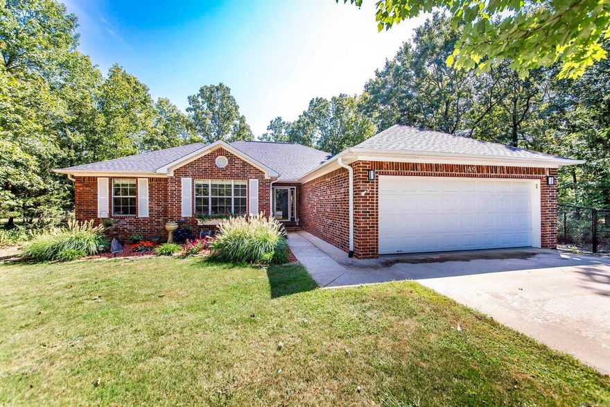 Nestled on scenic Indian Hills Golf Course, this exquisite single-story, NO STEPS, all brick home, offers the perfect blend of elegance, comfort, & modern living.  The kitchen shines with granite countertops & attractive tile backsplash. Enjoy the warmth of the beautiful gas fireplace installed in 2021. The newly added covered deck is a great place to enjoy the beautiful scenery of Indian Hills Golf Course & enjoy your morning coffee or evening gatherings with family & friends, while the fenced backyard is perfect for privacy & pets. Other upgrades include: new roof in 2021, new a/c in 2022, new paint, garage door opener, storm door, toilets, & landscaping. Located just minutes from Greers Ferry Lake & Circle Acres Boat Launch, you will also have access to 3 swimming pools, hiking paths, ATV/UTV trails & new pickle ball courts & tennis courts. This meticulously maintained home is more than a retreat; it's a gateway to the vibrant & nature-rich lifestyle of Fairfield Bay. Dive into the outdoor adventures which includes 2-18 hole golf courses & a 40,000 acre lake, (one of the cleanest in the U.S.). This home is move-in ready where modern living awaits. Schedule your viewing today.