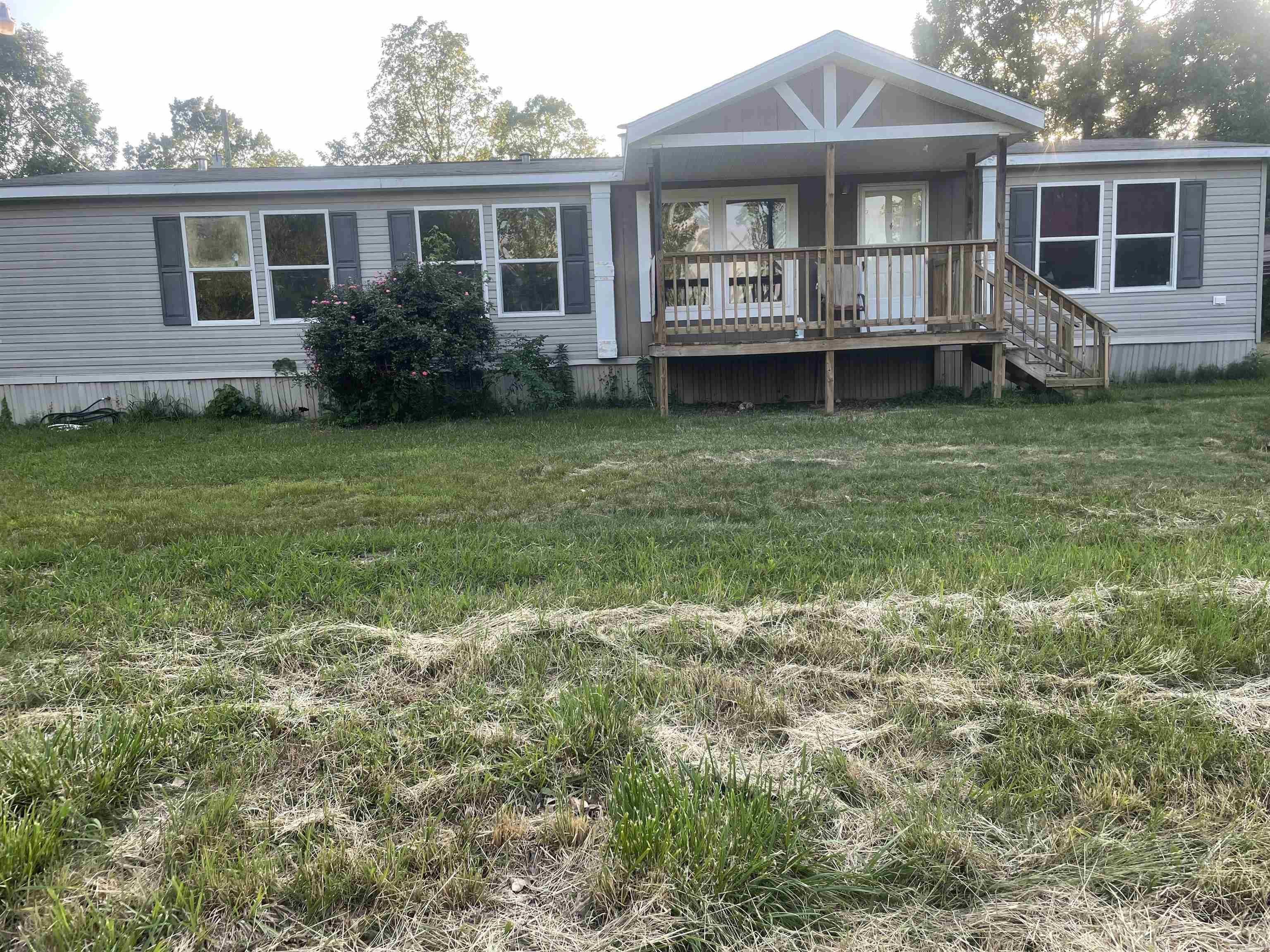 Come view this awesome rural property and home in the Bryant school district. Property located just 5 minutes from the city limits of Bryant right on Springdale Rd. 3.5 acres of cleared land. 3 bedroom 2 baths double wide mobile home. This could also be a great opportunity for rental property or new construction. Please reach out for a showing!!