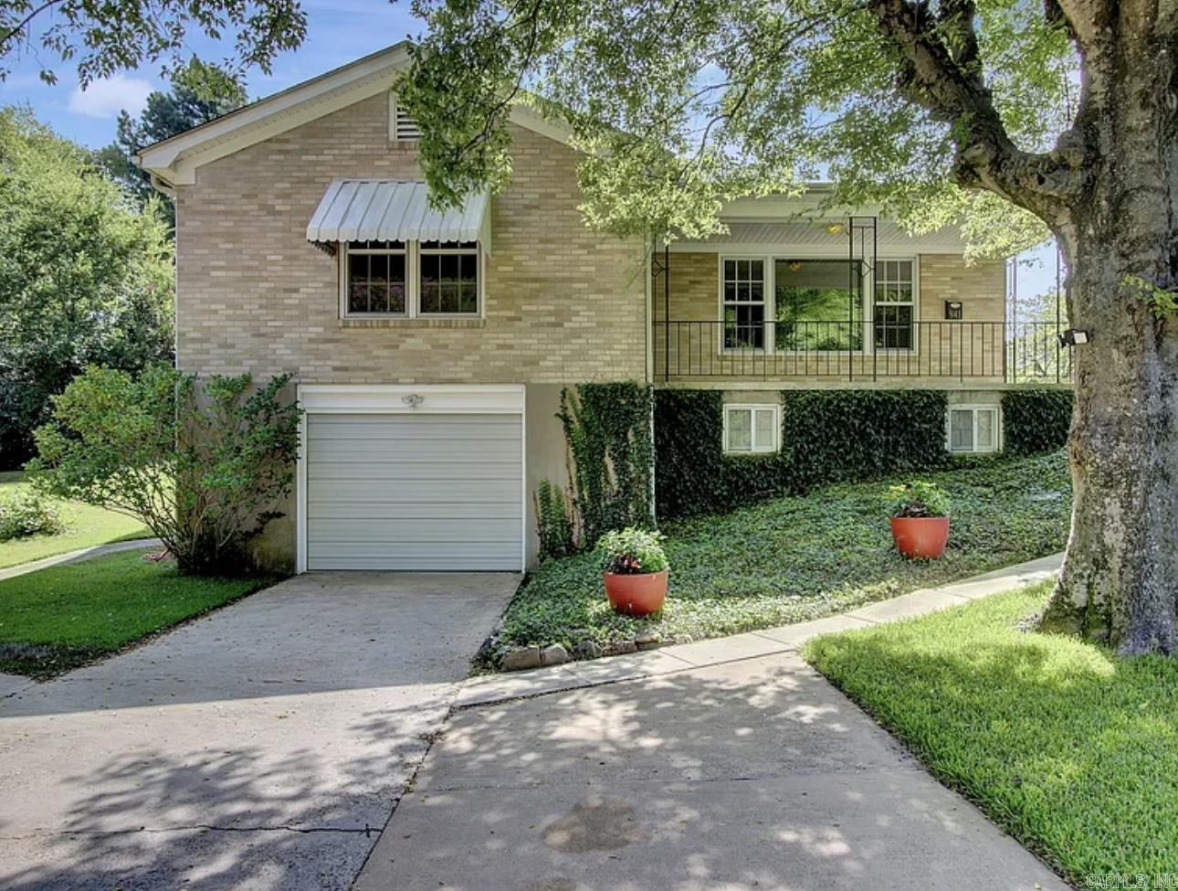 This charming home in the Hot Springs School District is ideal for first-time buyers or investors. Charming and spacious 2 bedroom, 1.5 bathroom brick house that was built in approx 1950 on a corner lot. Conveniently located just blocks away from Oaklawn Track/Casino. Well maintained with beautiful original hardwood floors throughout, custom built-ins and with abundant storage and closet space. Offering the perfect blend of comfort, convenience, style, and thoughtfully designed living space. Whether you're relaxing indoors or entertaining outside, this home checks every box. The square feet is approximated by adding the basement SQ FT to public records SQ FT. Listing agent is related to seller.