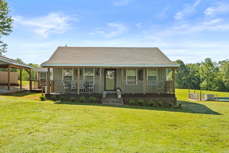 Welcome to Peace on Earth! Beautiful 3 bed, 2 bath farmhouse with 1,488 sq ft, built in 2023 and nestled on 18 stunning acres. This property features a large stocked pond and includes additional septic and utility hookups, perfect for a second home or RV. Enjoy serene views and complete privacy. Outside, you’ll find a 30x40 shop, 30x30 barn, above-ground pool, covered front porch, deck, basketball court, storm cellar, and an extra storage building/office. Inside, you’ll love the open floor plan, warm wood tongue-and-groove walls, and a kitchen designed for entertaining- complete with granite countertops, gas range, double oven, pot filler, and a walk-in pantry. The formal dining room features a stone fireplace, and there's even a mudroom/office for added convenience.The home is wired for a generator (generator does not convey). This is truly the kind of property everyone is looking for-peaceful, private, and move-in ready!