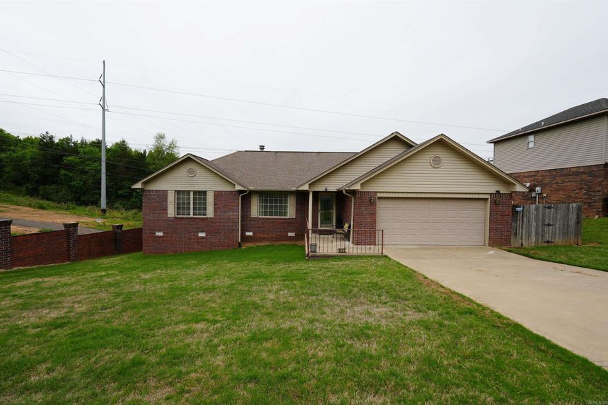 Great location! Great price! Extras included! This wonderful home features new carpet, new water heater, and owner is including large screen TV, washer, dryer and 2 refrigerators as well! Huge fenced yard, covered entrance/front porch and large deck are just a few of the bonuses that come with this home.