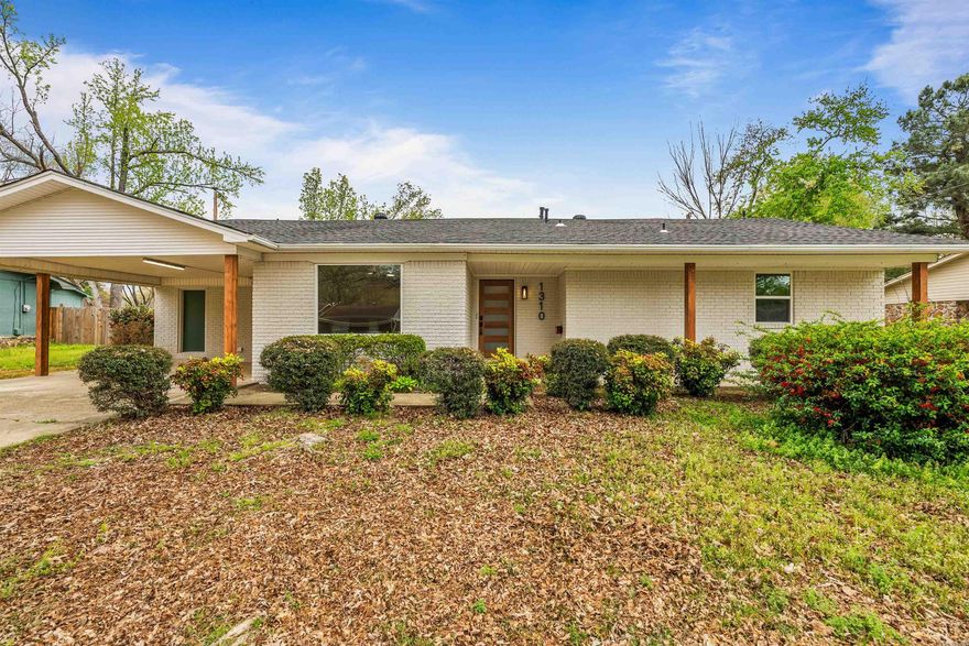 Step into something visually unforgettable, and perfectly positioned by CHS, Walmart, walking trails, and dining options. This is not just a renovation; this home has been completely overhauled and elevated beyond expectations. Featuring three bedrooms, two bathrooms, and two spacious living rooms, this layout was designed for both comfort and flexibility, whether you are hosting, relaxing, or creating separate spaces for living and working.   From the moment you walk in, you are greeted with warm LVP flooring, recessed lighting, and natural light pouring through brand new vinyl windows that highlight the character you simply cannot replicate in today’s builds. The kitchen stands out with quartz countertops, stainless steel appliances, a tiled backsplash, and floating shelves that blend style with function.  The primary suite delivers with a true retreat feel, featuring an oversized custom tiled walk-in shower and a generous closet. Secondary bedrooms are well-sized and supported by a beautifully updated bath.  Out back, enjoy a fully fenced yard, covered patio, and a powered storage building ready for hobbies or extra space. This home is a true standout and a sight to see.