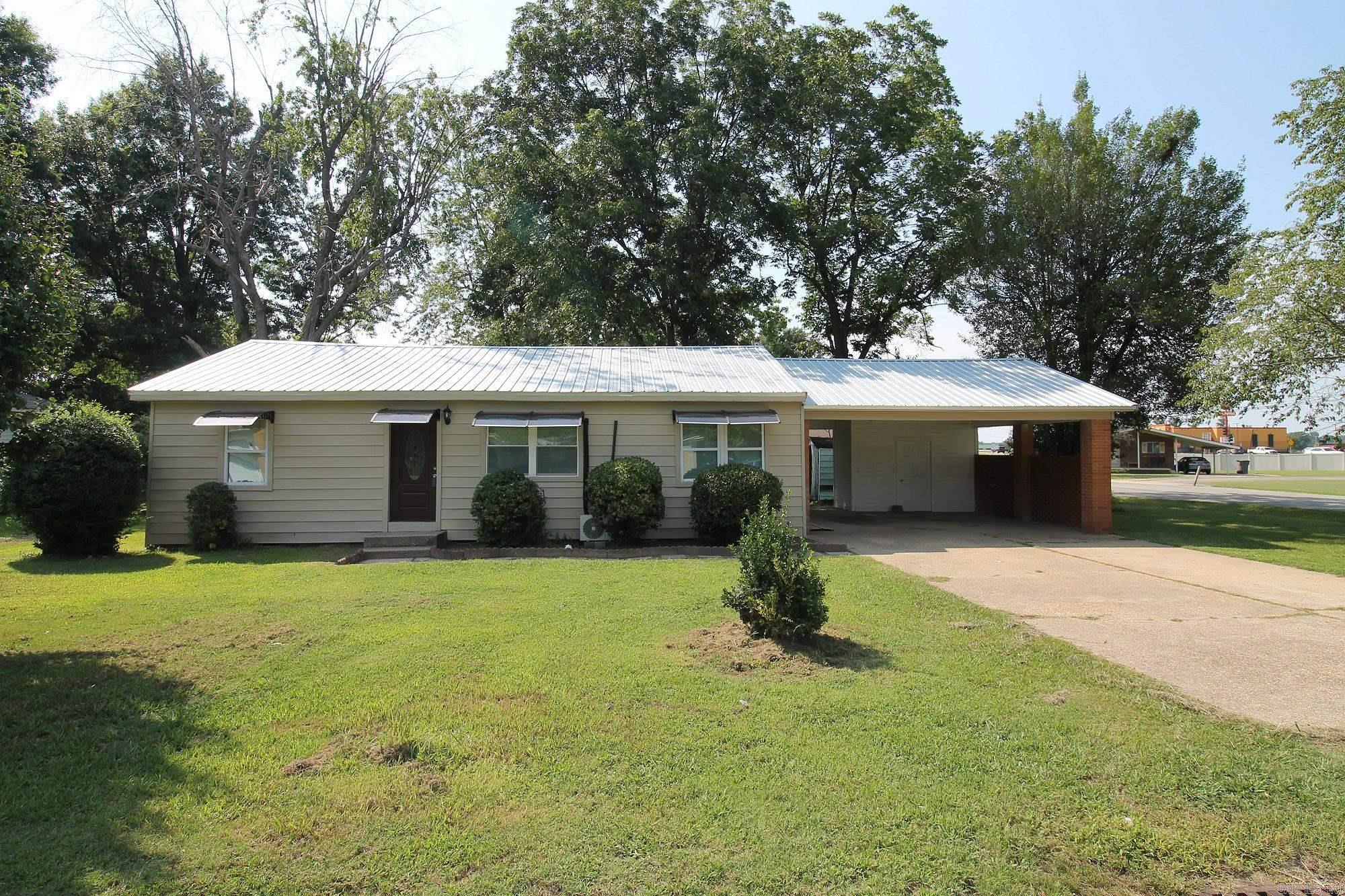 Stunning Remodeled Home on Corner Lot! Welcome to this beautifully remodeled 3-bedroom, 2-bathroom home featuring a desirable open floorplan, perfect for modern living and entertaining. Located on a spacious corner lot, this property boasts a durable metal roof and brand-new windows that enhance both aesthetics and energy efficiency. Step into the heart of the home—a stunning new kitchen equipped with modern appliances, sleek cabinetry, and ample counter space for all your culinary adventures. The living areas are bright and inviting, thanks to the new lighting fixtures that provide a warm ambiance throughout. Enjoy the convenience of a double carport, providing ample parking and storage. This move-in-ready home is not just a place to live, but a place to thrive. Don’t miss your chance to own this gem! Schedule a showing today! Seller to is willing to entertain any and all request- put it in the offer and let's talk!