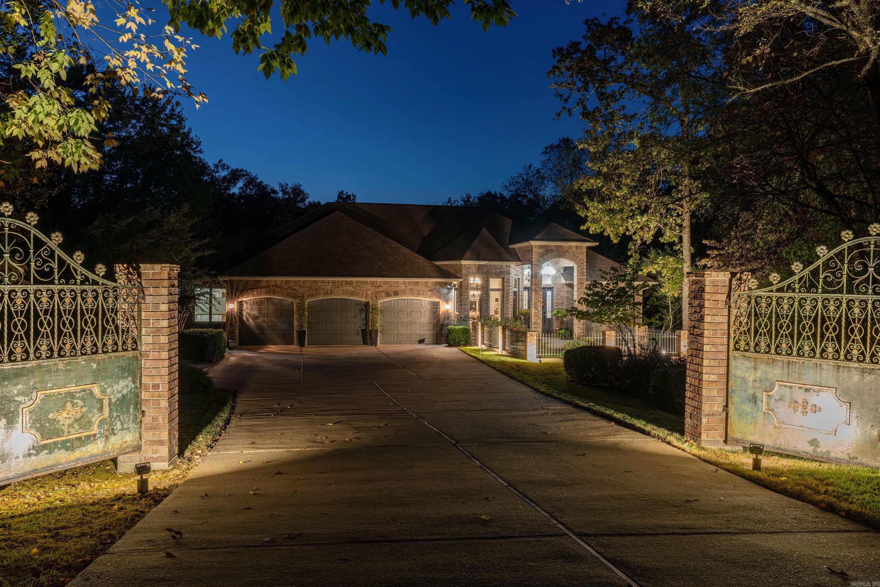 Welcome to this custom built manor home, nestled on a serene cul-de-sac on #2 Diamante green. Graced by ornamental gates, it was featured as a prominent interior designer's company brochure, as this residence showcases exquisite finishes throughout. Spanning more than 4700 sq. ft., the home offers 4 spacious bedrooms, 3 1/2 baths with 3 living areas and a separate study. The main floor features 3 bd and 2 1/2 baths with elegant DR, formal LR, den with FP which opens to the chef's kitchen. New appliances and quartz countertops added last year. Primary suite showcases large windows with custom shades, stunning bath with chandelier, his/her closets, separate vanities, loads of storage. Outdoor covered deck is perfect viewing golf and nature. Lower level includes a stunning study with FP, family room w/built ins and 4th BD and full bath. Outdoor porch is perfect place for enjoying sounds of the fountain. Storeroom has plenty of built ins. Courtyard in front is elegant and safe place for Fur babies. Situated on almost 1/2 acre, this exceptional home offers a lifestyle of elegance and tranquility. Enjoy belonging to Diamante, one of the best golf courses in Arkansas.
