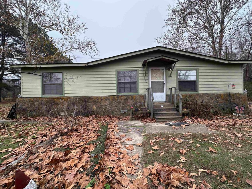 Three bed one full bath mobile home located on 1.6 acres.  Home comes with everything you see in the kitchen. The kitchen include New gas stove for all your cooking needs.  There is three year old mini split HVAC system to keep you cool in the summer and warm in the winter affordable.  In the Primary suite there is an additional space that used to be a Full bath and  exiting plumbing is avalible.  currently being used as a small bonus room. Home is setting on a large flat open 1.63ac lot.  Plenty of room for you to grow your own vegetables or even have some small animals.