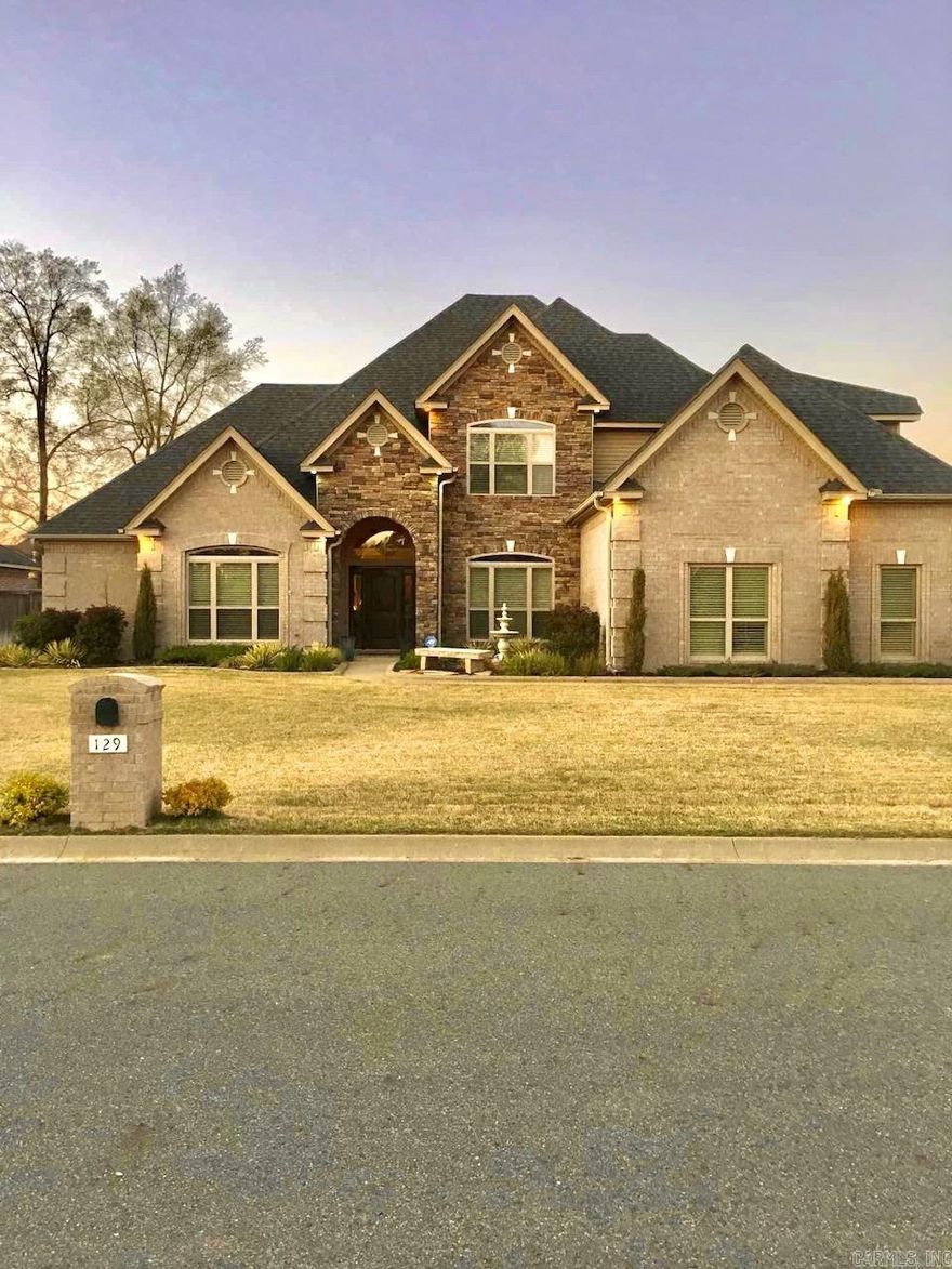 2.99% assumable VA loan!!! Home was custom built by Jack Wilson. Floor to ceiling windows in kitchen/hearth room overlook privacy fenced salt-water pool, fire-pit, covered porch,covered patio,lawn & outdoor kitchen. Double fireplace between hearth room & living rm. Kitchen equipped with gas cooktop & double ovens. Large breakfast bar,center island,solid wood cabinets,granite countertops,2 pantries. Downstairs guest room/office w/bath. Downstairs primary suite with luxurious bath,jetted tub,large shower,dual vanities,2 huge closets.    Gameroom upstairs and 3 large bedrooms with ensuite baths & attic access. 3-car side loading garage with storage. Don't miss this one.