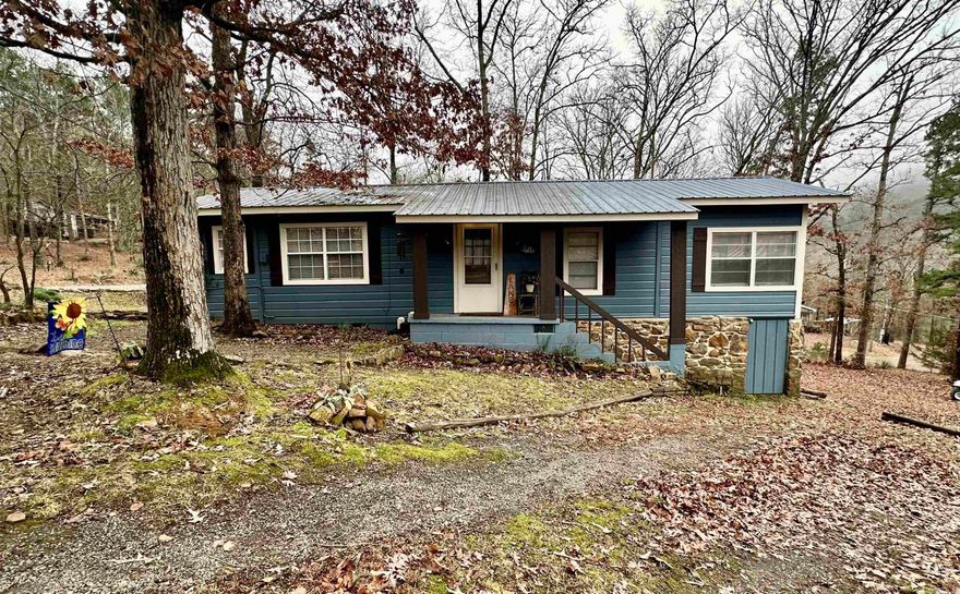 Escape to tranquility with this charming retreat in Drasco, AR! Located just across the street from the shimmering lake, this move-in-ready home offers breathtaking views and a serene, quiet neighborhood. Perfect for nature lovers, the property features a relaxing creek in the backyard, a spacious sunroom for enjoying the scenery year-round, and a large back porch ideal for entertaining or unwinding after a day on the water.  The home is partly furnished, including an extra refrigerator and ice maker, blending comfort and convenience. Current owners installed a Panasonic split unit in the living room that provides heat and air. The community boat ramp ensures easy access to all your lake adventures. Whether you’re looking for a weekend getaway or a permanent residence, this gem offers it all. Don't miss the chance to make this peaceful retreat your own!
