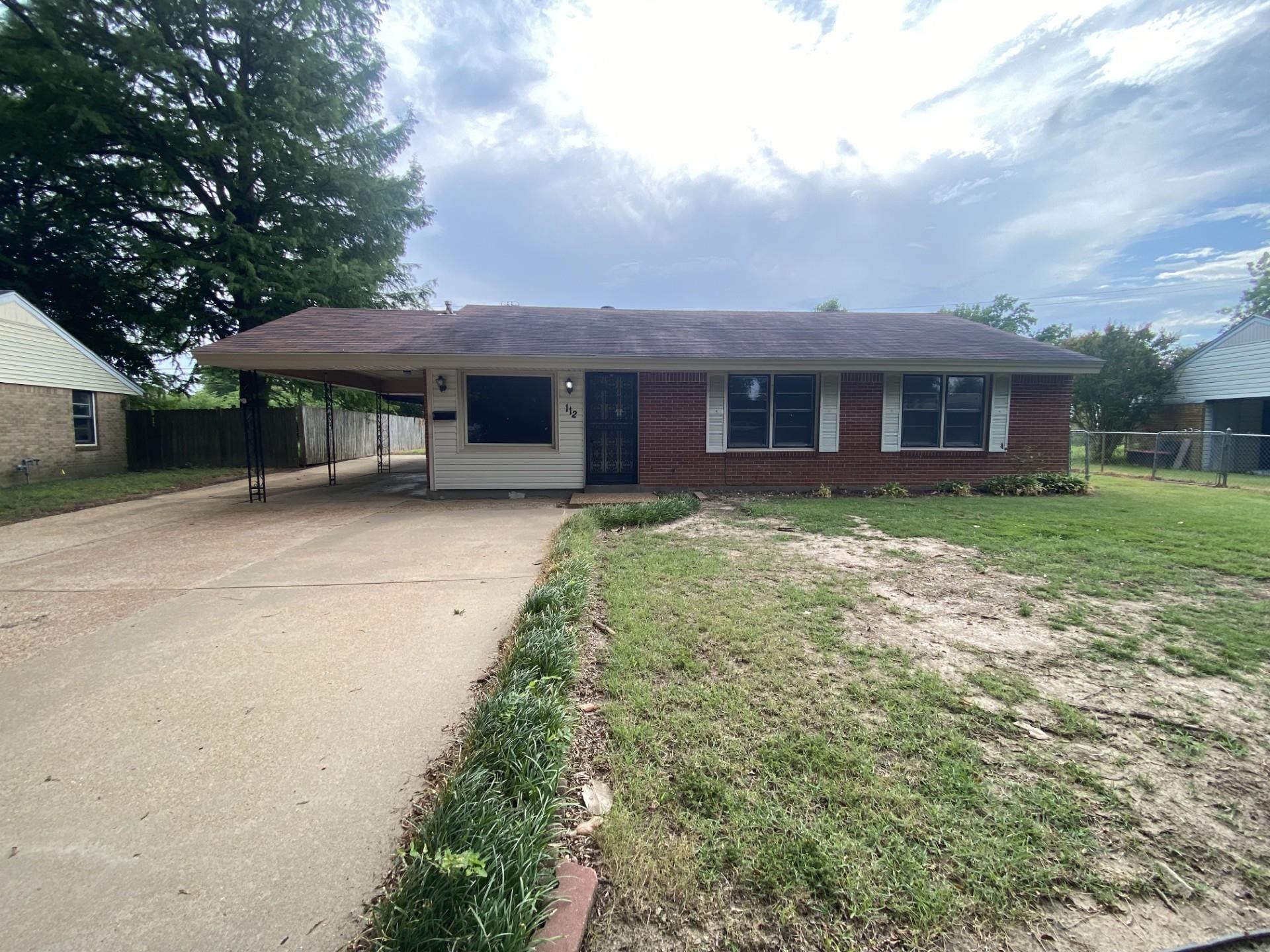 4 bedroom/2 bath, new kitchen cabinets, new appliances, with a large family room with a wood burning stove, carport storage building, large fenced around backyard except for behind the carport.