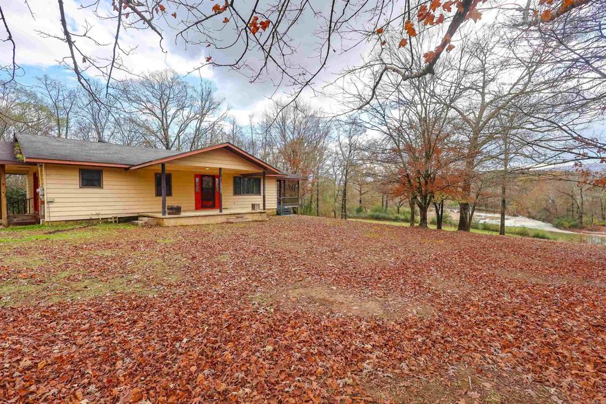 Situated along the beautiful Caddo River, this approximately 7.5-acre property offers direct water access and a scenic natural setting that’s increasingly hard to find. With a blend of open and wooded acreage, the land provides a versatile canvas for recreation, relaxation, or future development. Enjoy fishing, kayaking, and taking in spectacular river views right from your own property.  The existing home offers a functional starting point for those looking to update, renovate, or build over time. Whether you're searching for a weekend retreat, investment opportunity, or a place to create your own riverfront escape, this property presents exceptional potential with its acreage, river frontage, and flexible use.