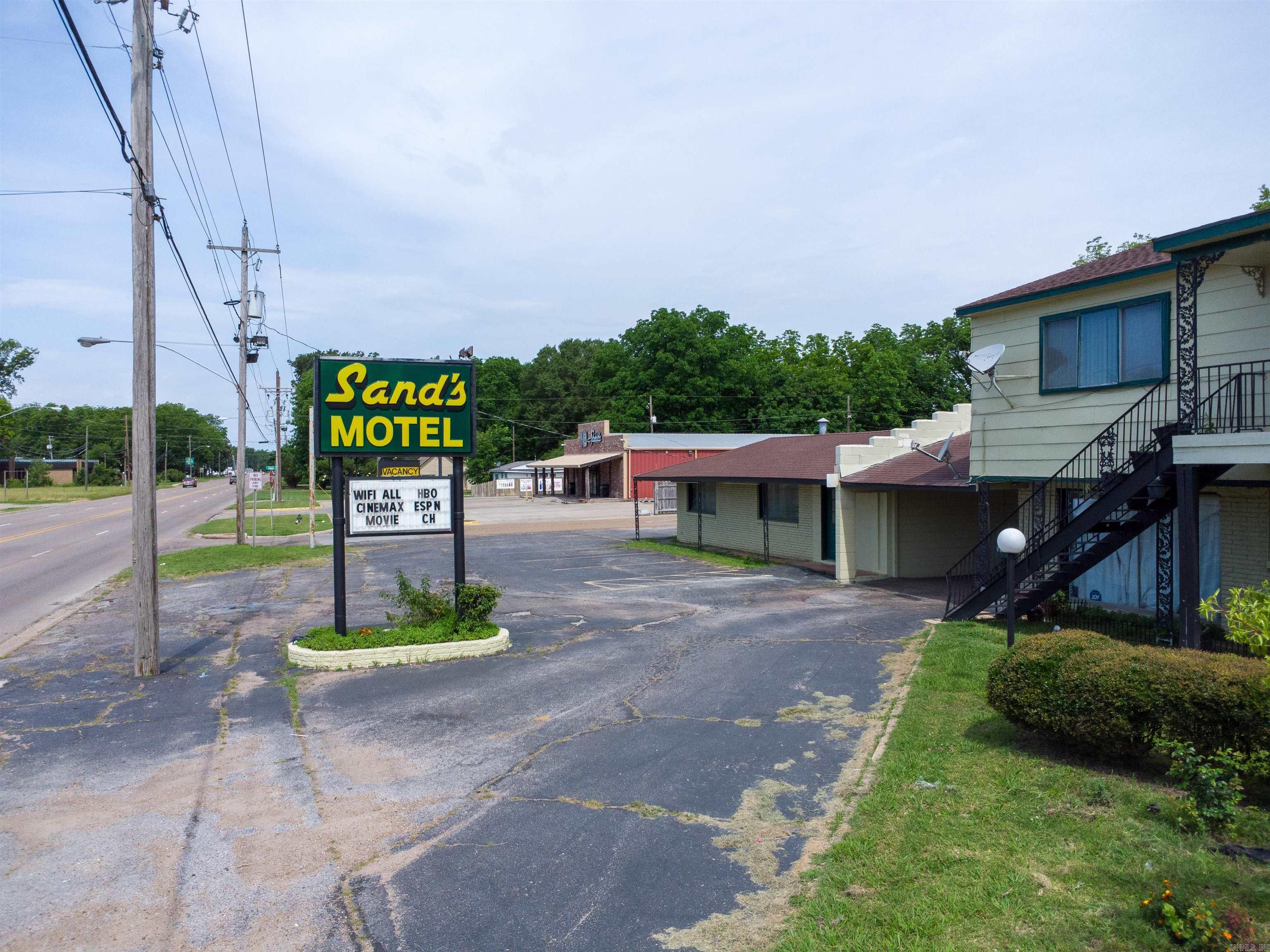 Calling all investors! This is the opportunity you've been waiting for! Check out one of the longest standing establishments located in the heart of West Helena, AR. It's better known as the Sand's Motel. With the right management, this motel could be thriving once again in no time. It boasts 26 rooms with double & single beds, at least 30 parking spots, some new furnishings, updated baths, storage bldg, & an attached bldg once used as a restaurant. This property is located in a prime location with high visibility. It is close to everything even within walking distance. The restaurant area of this property could be renovated & re-opened. There is a need for new restaurants & entertainment. Imagine transforming this property into a single-room apartment complex! Or even housing Veterans utilizing grant funds from the federal government!  Oh, the possibilities! How about transforming it into a Professional Office space and leasing each space as an office suite to professionals that do not require a large space? Ever thought about developing a mini mall? There are endless possibilities for this property. Call today for more info or to schedule your personal tour of this property.