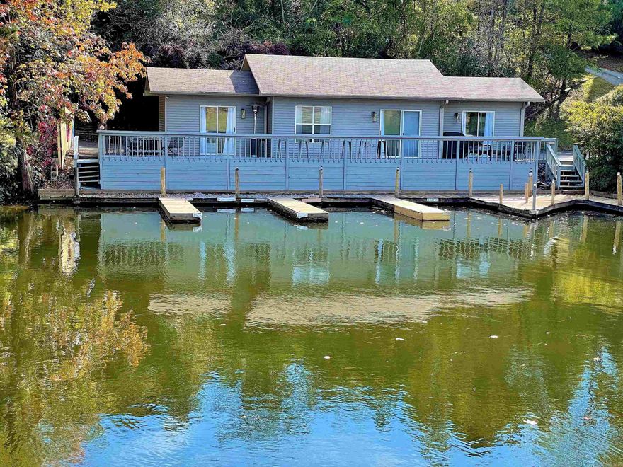You cannot get closer to the water!  Free standing one level townhome right on the water. 2 bed 2 bath. New roof. Nightly rentals allowed, no need for a license because out of city limits.  Your own personal boat slip literally steps off of your deck.  HOA is only $50 a month! Tons of parking and privacy. In a quiet cove just off the main channel. Fully furnished ready for you or your guests.