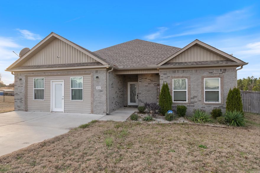 This one-level home is situated on a property where chickens and horses are welcome. It features a split-bedroom floor plan for added privacy and includes hookups for a hot tub. One room is wheelchair accessible, with easy entry from the bedroom into the bathroom. The home is also equipped with extra outlets for a refrigerator, microwave, TV, and more. The garage has been converted into a TV/flex room, providing additional living space. A home warranty is currently in effect for peace of mind. As an added bonus, seller is negotiable to converting the bonus room back into a garage!