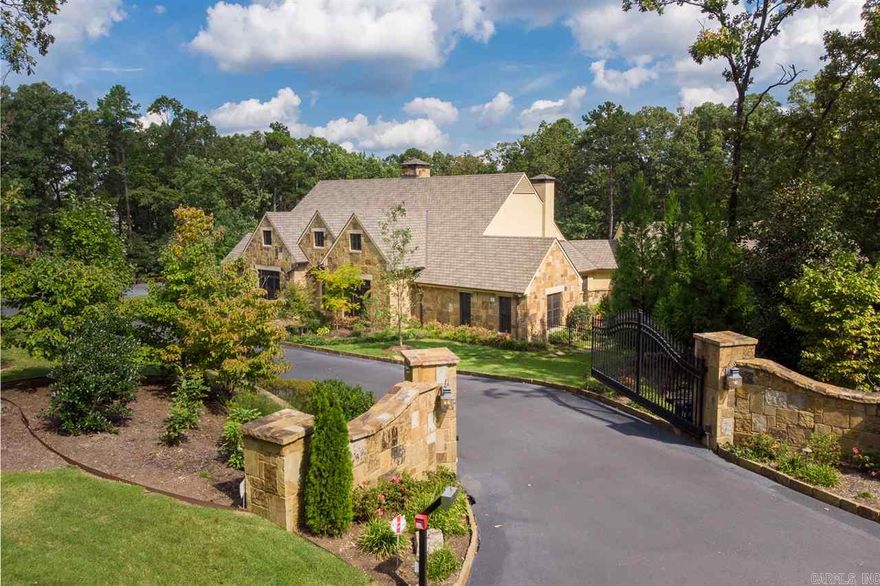 Unbelievable estate! Outdoor, private living & entertaining- outdoor FP, sitting area, grill, heated gunite salt water pool with spa. Stone exterior, gated, generator & extensive landscape. Travertine, coiffered & barrel ceilings, craft/exercise room, mud room & pool bath. Chef's kitchen- granite island, 6 burner gas, ice machine. Master suite walnut hardwoods, onyx floors/shower, 2nd laundry in closet. Walnut walls & floors in office. FEMA safe room (176 SF), walk up attic bonus (390 SF) not included in SF