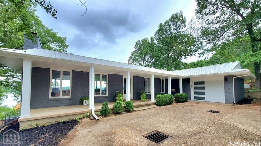 THAT VIEW! Completely remodeled and move in ready lake front home on a lot and half, approximately 1 ac +/-, with separate 30x24 metal shop building. The Great Room will make you pause with vaulted wood ceiling, floor to ceiling rock fireplace, custom built-ins, unbelievable lake view and is open to the kitchen with all new appliances, granite countertops including a 7' island, pantry and lake view. Master suite and 2nd bedroom & bath are on main level, both with enormous lake views.