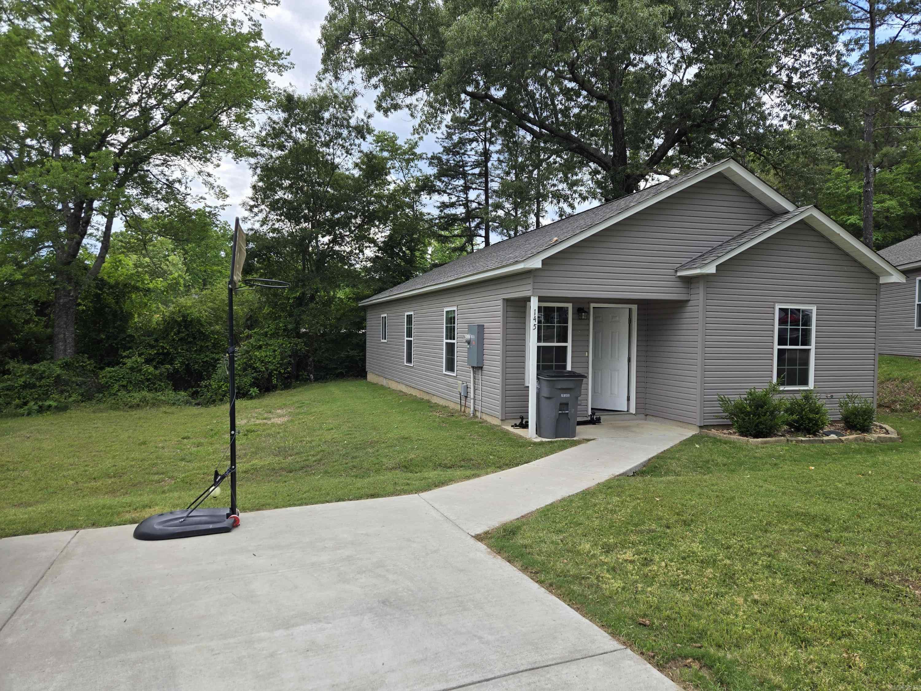 Oh my my, Check out this stunning newer home, showcasing a perfect blend of style, efficiency, and affordability in Hot Springs, Arkansas. Located in the often sought-after Lakeside School District, this modern patio home features eye-catching designs and contemporary finishes. With its sleek modern colors, stylish flooring, and gorgeous granite countertops, this home stands out on 2 lots, creating more yard space and charming curb appeal. Ideal for those who appreciate both aesthetic and practicality, this home is designed for comfortable living. Positioned in an excellent location, you'll be just 5 minutes from Oaklawn Gaming and Racing, making it a fantastic choice for entertainment enthusiasts. Plus, you'll be only 10 minutes away from the historic downtown area, renowned for its iconic bathhouses and vibrant atmosphere. Donāt miss the opportunity to make this inviting patio home yours in the heart of this famous cityāperfect for both relaxation and enjoying all that Hot Springs has to offer!