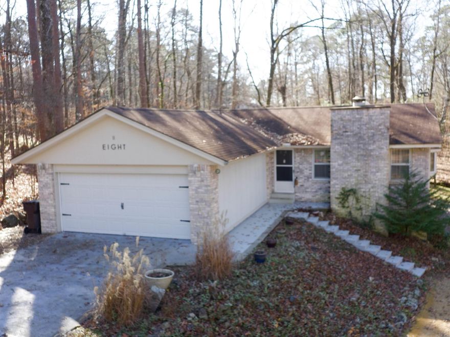 This light filled home is just minutes from the West Gate, making shopping trips or errand running a breeze.  It features an easy living floor plan with a spacious sun room and updated bathrooms. The third bedroom is accessed through the second and may be used as a sitting room or craft space. There is a huge storage space under the house for all your 'stuff'.  Estate Sale prep ongoing, sale to be Jan 9,10 & 11.  Agents see remarks.