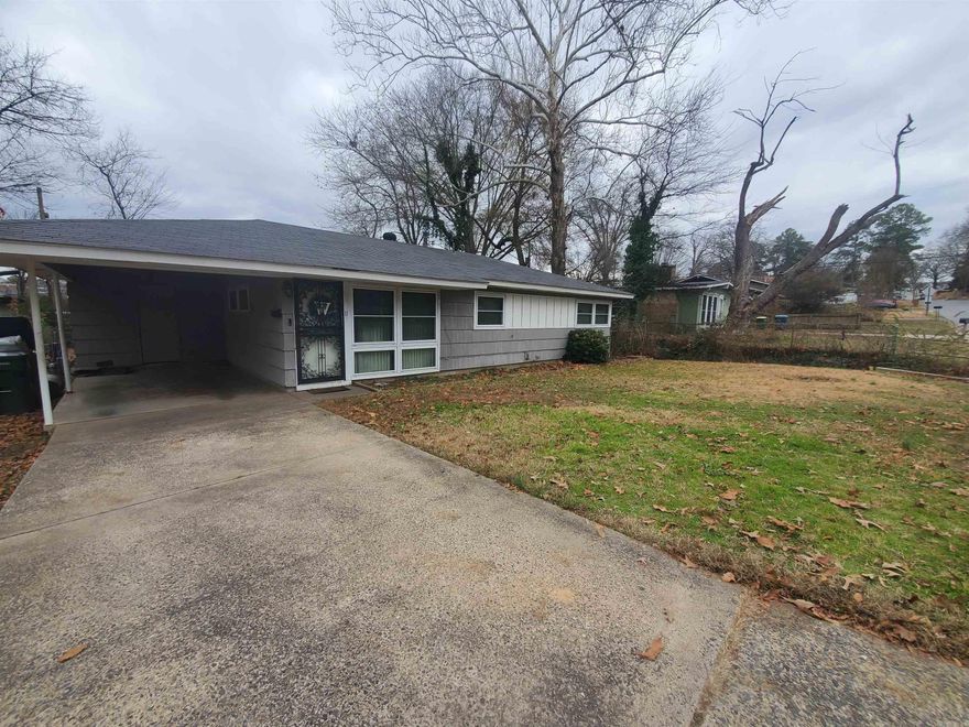 Near mid-town & UALR, this 3 bed level home owned by longterm homeowner has no steps leading into home & minutes from hospitals, interstate & shopping. Updated kitchen cabinetry and countertops, tile flooring throughout (NO CARPET) & spacious dining area opens to great room & kitchen. Bedrooms are spacious with nice size closets, updated bath & laundry inside home. Roof less than 8yrs old, newer windows, new HWH w/ with alarm sensor, outside storage room, alarm & carport make this home complete. Under 100k makes this a budget friendly home perfect for the investor, retiree & first-time homebuyer. Encourage sq foot measurement. Make your appt TODAY!