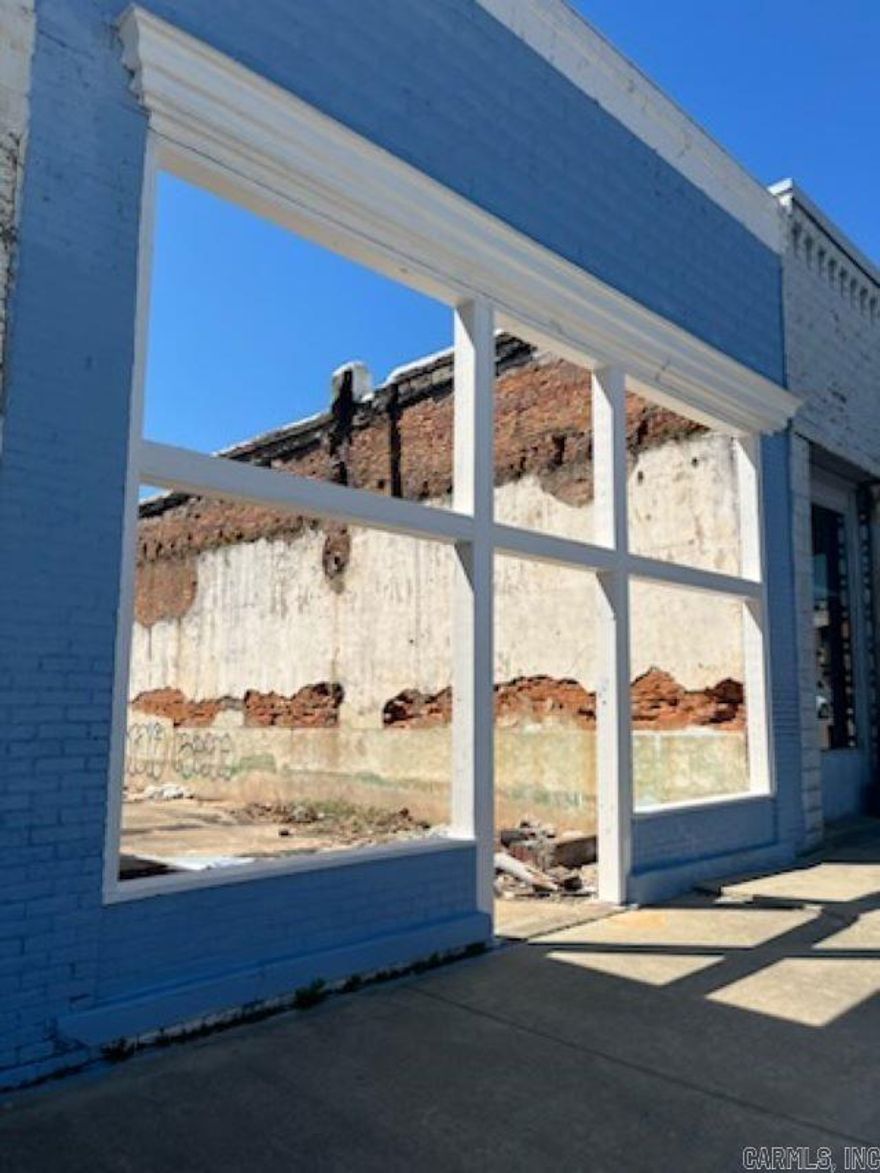 Situated in the heart of Historical Downtown Paragould, this property offers a prime location for attracting both locals and tourists. Since construction hasn't started, buyers have the opportunity to customize the design and layout according to their vision...OR...buyers have the opportunity to customize the design and layout according to their vision. However, this property has renderings and floorplans available. The seller's documents include architectural drawings and blueprints for a two level restaurant with an open-aired rooftop patio. These are available upon request. Presently, there is only the store front, and no current construction has been made.