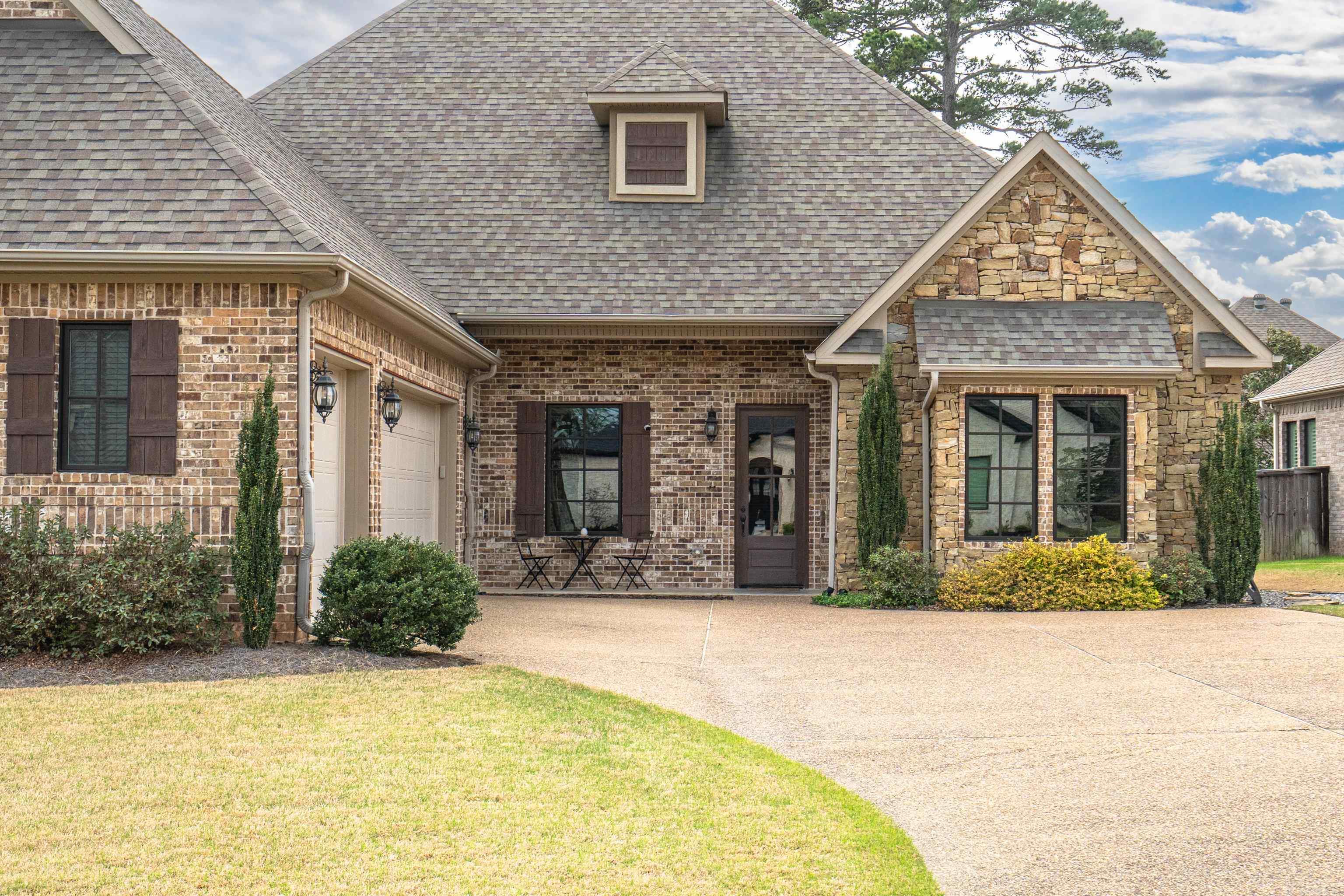 Elegant Traditional Home in Gated Arlington Park Welcome to this beautifully appointed 4-bedroom, 3.5-bath home in the exclusive, gated community of Arlington Park in Hot Springs. This classic brick residence features soaring 12-foot ceilings in the living and dining areas, crown molding, a fireplace flanked by custom built-ins, and abundant natural light. The chef’s kitchen is a standout with a 6-burner gas range, double ovens, a built-in microwave, farm-style sink, pantry, and elegant finishes. The spacious primary suite offers double vanities, a jetted soaking tub, and a large walk-in shower. Two of the guest bedrooms share a Jack-and-Jill bath, while a fourth bedroom and private study provide flexible living space. Step outside to a covered patio with its own fireplace—perfect for entertaining or relaxing year-round. This thoughtfully designed home combines timeless style with modern convenience. Interior finishes include engineered wood and tile flooring, crown molding, and ample storage throughout. From the open-concept living areas to the quiet, gated setting of Arlington Park, this residence presents a rare opportunity to own in one of Hot Springs’ most desirable areas.