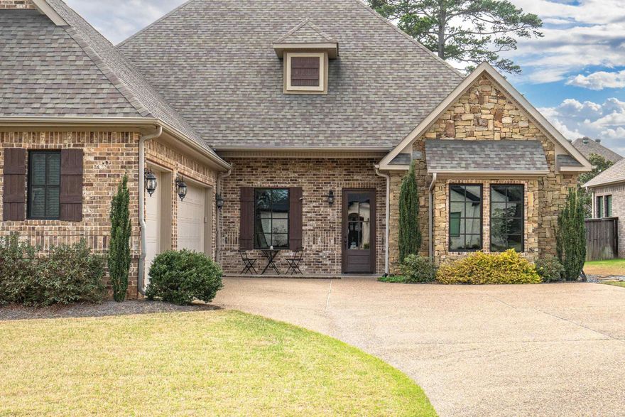 Elegant Traditional Home in Gated Arlington Park  Welcome to this beautifully appointed 4-bedroom, 3.5-bath home in the exclusive, gated community of Arlington Park in Hot Springs. This classic brick residence features soaring 12-foot ceilings in the living and dining areas, crown molding, a fireplace flanked by custom built-ins, and abundant natural light. The chef’s kitchen is a standout with a 6-burner gas range, double ovens, a built-in microwave, farm-style sink, pantry, and elegant finishes. The spacious primary suite offers double vanities, a jetted soaking tub, and a large walk-in shower. Two of the guest bedrooms share a Jack-and-Jill bath, while a fourth bedroom and private study provide flexible living space. Step outside to a covered patio with its own fireplace—perfect for entertaining or relaxing year-round. This thoughtfully designed home combines timeless style with modern convenience. Interior finishes include engineered wood and tile flooring, crown molding, and ample storage throughout. From the open-concept living areas to the quiet, gated setting of Arlington Park, this residence presents a rare opportunity to own in one of Hot Springs’ most desirable areas.