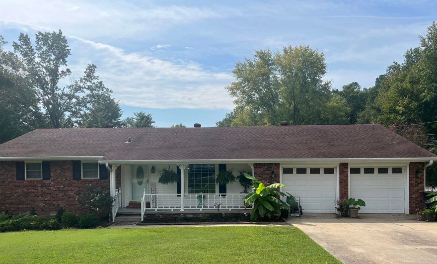 Beautiful brick ranch home on large corner lot! MOVE IN READY!11 1126 Pleasant View Ln is located in Piggott AR and it has a lot to offer its new owners! This beautiful brick ranch home has 1528 sq ft. It sits on a large beautiful corner lot with beautiful landscaping, in a highly sought after area of town. It has two bedrooms and two baths. Primary bedroom has an ensuite and walk in closet. This home has an open concept floor plan joining the living, dining areas and kitchen. The kitchen is very spacious with tiled counter tops and flooring. There is an abundance of cabinet and counter space. The kitchen peninsula is large and is a great space for family meals. The Stainless Steele refrigerator, dishwasher, and stove convey with the home. Appliances are about a year old. Just off the dining and kitchen area is the back deck overlooking the backyard. There is an outside storage building (12 x 16) with electricity. The laundry room is oversized with two storage closets and built in cabinets providing lots of storage options. There's an entryway from the two car garage into the laundry room just off the kitchen. Updates include flooring, lighting, toilets, and paint. Must see!