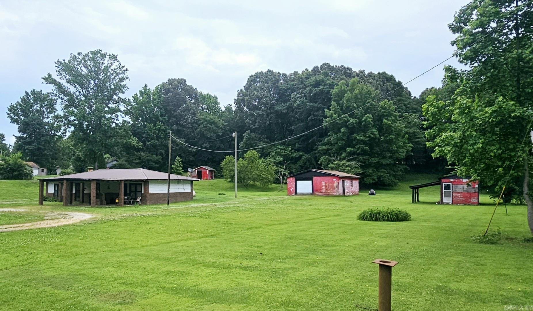 Looking for country living with the convenience of town only minutes away? This is it! Check out this 2 Bedroom 1 bath house nestled on just under 2 acres. This unique property features mature trees, 2 storage sheds, 1 shop & lots of room for a garden, pond or pool! Call today to set up your personal tour of this quaint home & acreage. This property is being sold as is allowing the new owner to update the house to fit their needs.