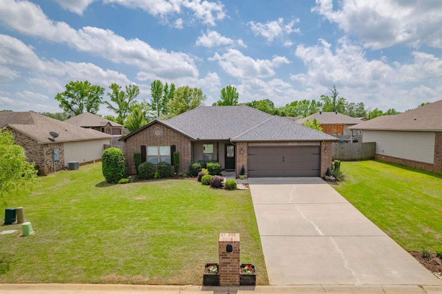 Oh My, She's a Looker! Entering the home one immediately notices the trim detail & accents right away especially in the multi-tray living room ceiling. This ultra open concept home boasts a split floor plan along with a shop bldg in the backyard too! The semi-custom living room is central to the home, ideal for family life & entertaining. The kitchen w/granite counter tops & breakfast bar overlook the living room w/an eat in kitchen overlooking the backyard. In the kitchen & dining areas notice the custom accent wall plus chair rail trim. The kitchen also boasts a nice tile backsplash w/under & over cabinet lighting too. Stainless appliances adorn this already stunning look! The bedrooms are comforting tones w/carpet flooring. The guest bathroom has granite counters & a custom sink/vanity. The Master Bedroom & Bath is just amazing! Entering one notices the accent wall & accent trey ceiling plus the spacious bedroom size & closet w/built in drawers. The bathroom has his & her custom vanity sinks w/granite counters, a bath tub and custom tile shower. Nearby is also the laundry room w/wall mount cabinetry too. Roof was replaced in 2023. See Agent Remarks.
