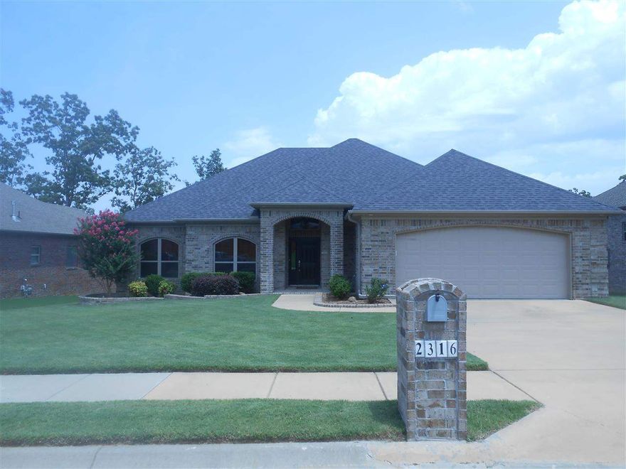 Must see, one owner home. Immaculate 4 bedroom, 2 bath home. Built in 2010 with an ultra modern open floor plan with bamboo flooring kitchen/bar area, all stainless appliances with beautiful granite countertops in kitchen and all bathrooms. Incredible finish work includes crown molding in each room, large walk in closets, exterior storage room, covered patio with deck, and an oversized two car garage with a climate controlled storage area/workshop.  Don't miss out on this one, won't be around long!