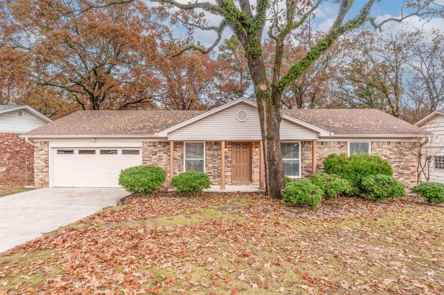 Walton Heights! Want to live in the city with convenient access to everything and back up to the River Mountain Trail?  Little Rock's only pro built mountain biking trail.  This well maintained one level home offers updated kitchen appliances, corian countertops, canned lighting, LVT flooring, newer windows, carpet and paint. From the deck you can enjoy views of your fenced oversized backyard and the River Mountain Trail. The 0.36 acre lot includes two fenced areas.  New appliances and flooring 2019, new water heater 2021 and new roof 2012.  The home has Leafguard gutters. A workbench with pegboard in the garage conveys with the home sale. The seller is providing a one year Home Warranty for the buyer.