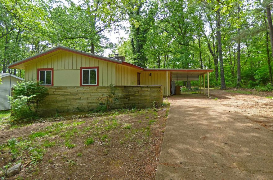 Two Bedroom Home in Great Location - This home offers easy access in the out of Cherokee Village, Located close to the south entrance and schools. It has 2 bedrooms, 1 full and 1 half baths, living room with a fireplace, kitchen with plenty of counter space, utility room, vinyl plank flooring and a metal roof. Great investment property if you are looking for rental property.