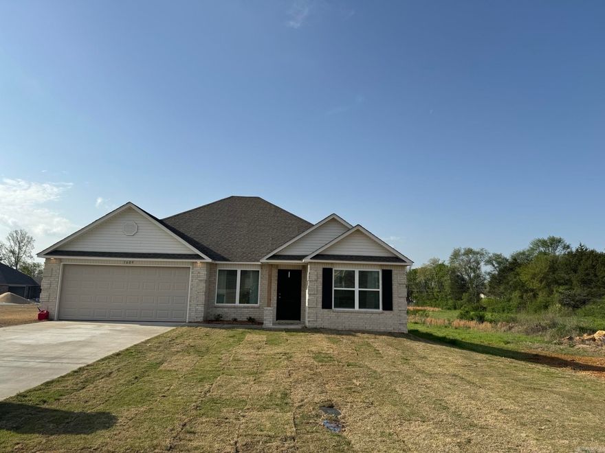 Carnegie II plan  Upgrades in home: sides brick on home, 14'x10' uncovered patio, 8/12 roof with architectural shingles, plumbing faucet upgrade 2, 8" deep Kitchen sink, added cable jack, HVAC rigid duct upgrade, staggered Kitchen cabinets, Luxury Vinyl Plank flooring in wet areas and Living Room and adjacent hallways, garage door opener, raised ceilings in Living Areas per municipal requirements, Cheyenne style doors, baseboards level 2, LED disk lights in Kitchen and second LED over Master Bath vanity, full sod, microwave hood in Kitchen, smooth top range.