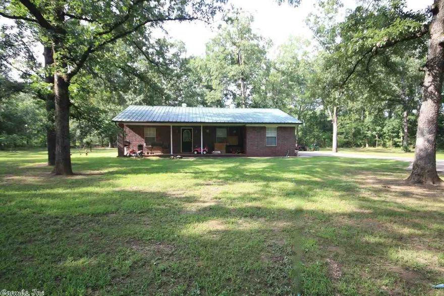 Tucked away and private on 1.56 wooded acres is this adorable home just outside of Conway city limits.  3BR/2BA with 9x10 storage bldg.  Large open kitchen w all appliances. Split plan, needs a little cosmetic refreshing on the interior but has incredible potential.  Has a brand new HWH & 5yo HVAC.  Exterior has a yard that looks like a park with big trees, basketball goal, playset, privacy fence on 1 side and small creek at the front of the property.  Less than 10min from interstate. See agent remarks.