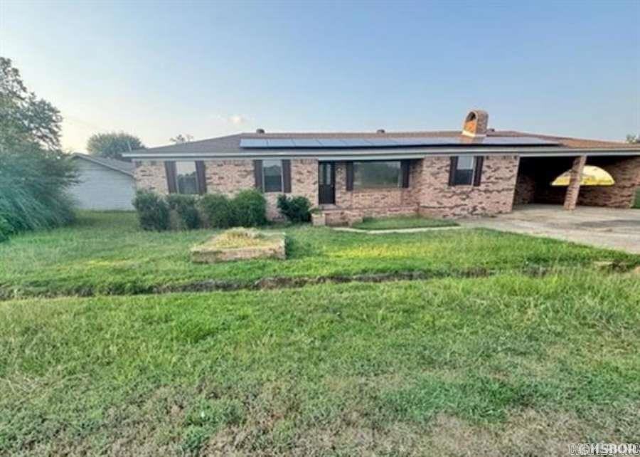 DIERKS, AR.. beautifully renovated brick home $215,900! open living area/formal dining combo with fireplace; gorgeous laminate floor covering throughout; kitchen has breakfast bar, informal eating area, stainless steel appliances with exception of refrig, even a cook's oven!! jetted tub in primary bathroom, lots of storage/cabinets; newer roof with some solar panels, workshop with electricity and large storage building, and covered parking; outside grill/smoker is not warranted! this is a must see - offers no carpet and is move in ready