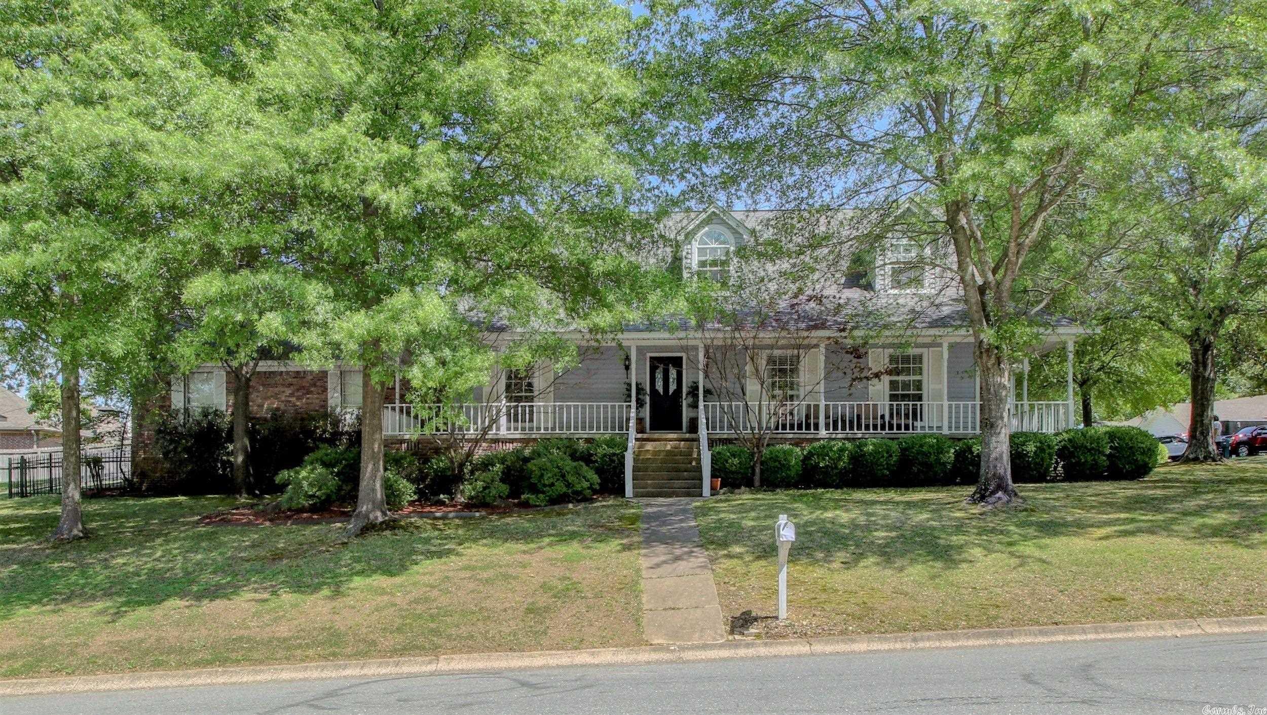 This beautiful 3-bedroom, 2.5-bathroom home is located in the heart of the North Little Rock/Sherwood area. The house features a stunningly remodeled kitchen, a spacious living room with a floor to ceiling brick, wood-burning fireplace, custom closet built-ins in office and laundry room, formal dining room with wainscoting, LED recessed lighting throughout the home. Nestled on a corner lot, with a wrap around porch, iron privacy gate to a private back yard. The back-entry garage is off of Illinois Bayou. Gorgeous primary suite with completely remodeled en suite bathroom. Gas range. Wood blinds. Updated light fixtures and hand-scraped wood floors and tons of finished storage space. All the extras! Upstairs unit replaced in 2017. Upstairs coils replaced in 2023. Water heater replaced in 2021. AGENTS PLEASE SEE AGENT REMARKS