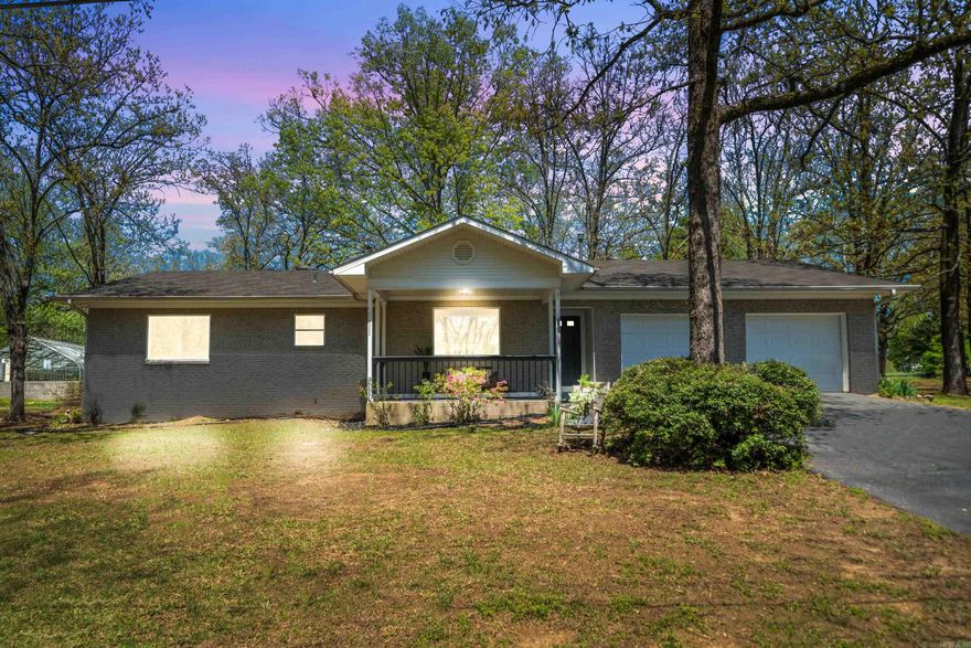 Welcome to your dream retreat! This beautifully renovated home combines modern comforts with serene natural surroundings. Nestled just steps away from Lake Hamilton, this property offers tranquil water views and a laid-back lifestyle. Inside, you’ll find a bright and airy open-concept layout, featuring stylish upgrades—new flooring, a contemporary kitchen with stainless steel appliances, and quartz countertops  Large windows bring in natural light and showcase the lake view, making every day feel like a getaway. Enjoy morning coffee on the front porch overlooking the water or launch your boat just down the road for a day on the lake—perfect for fishing, kayaking, or simply soaking in the scenery. Whether you're looking for a weekend escape or a full-time haven, this move-in-ready home delivers comfort, charm, and unbeatable access to nature and the amenities Hot Springs has to offer.