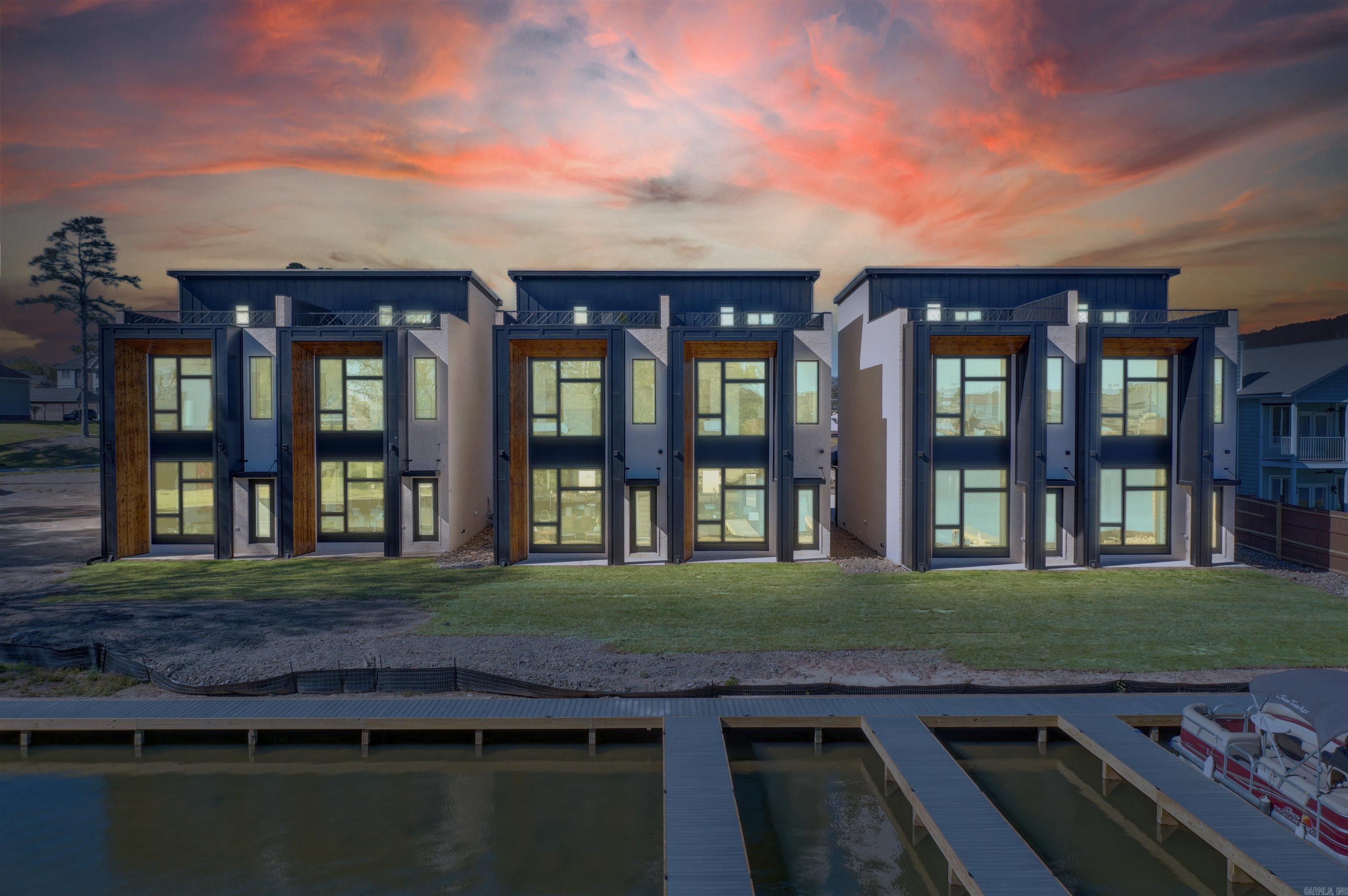 Enjoy luxury living in Lake Hamiltons newest Rooftop Townhomes. With modern design and high end finishings these fully furnished townhomes are guaranteed to impress! Outside of city limits but only minutes to all amenities Hot Springs, AR has to offer. Souring 10-12' ceilings with oversized windows give a bright and airy feel. Short-term rentals allowed, or keep for your own personal or corporate getaway. Extra sound insulation in between units for increased comfort and privacy. Buy one unit or up to 6 units, and plans/specs available for 8 more units. First come first serve on available boat slips for purchase.