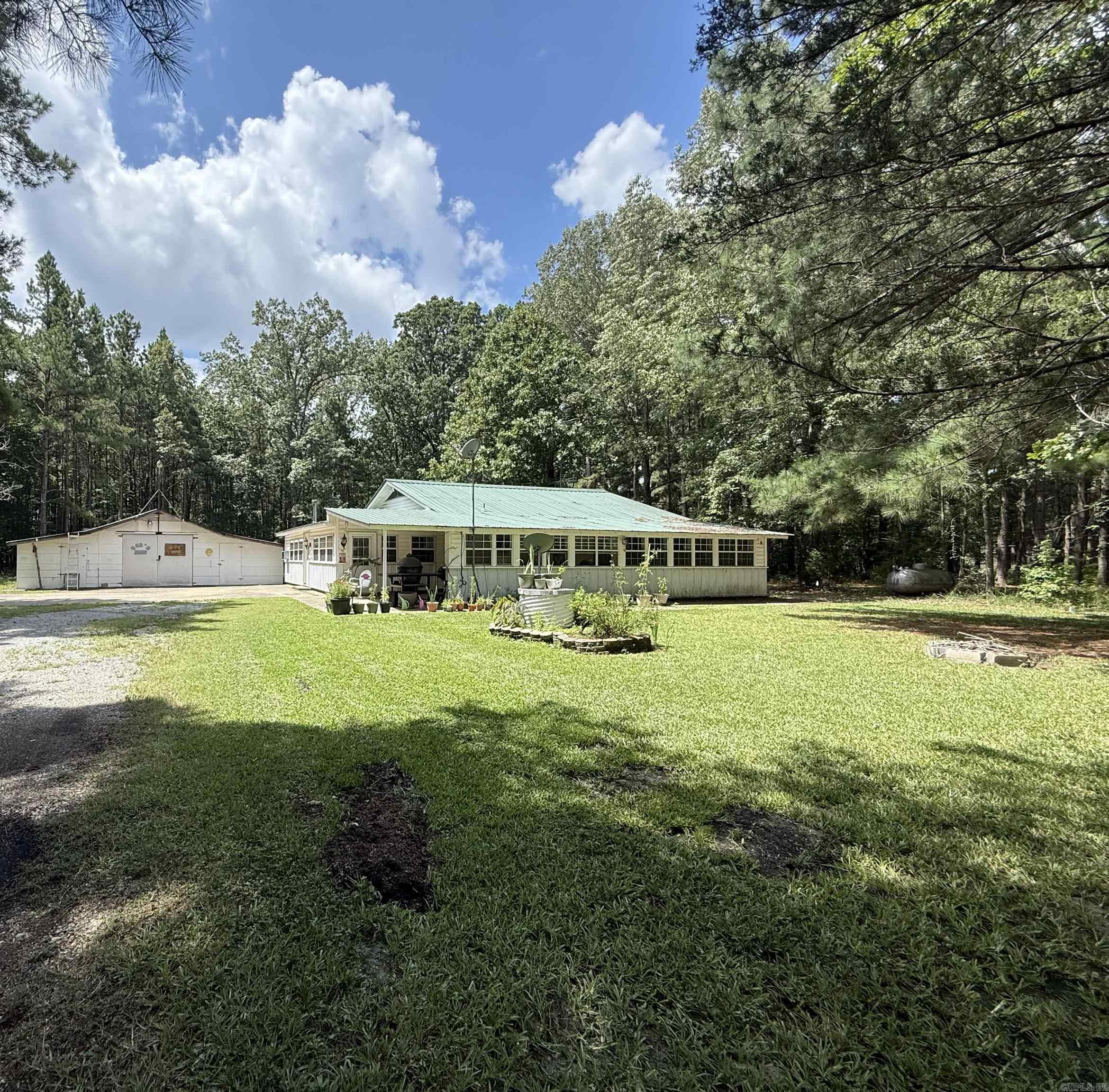 LOCATION!!!! ACREAGE!!!! Check out this charming 2 bedroom, 2 bathroom home sitting on 3 beautiful acres!! This home was completely remodeled in 2020. Some of the updates include granite countertops, ceramic tile backsplash, flooring throughout, interior paint, enclosed sun room or use as office, as well as an additional enclosed room on the other side of the house which could be an office or bonus room. New vanities with ship lap as well as updated kitchen. Walk in closets and laundry/mud room as well. You will love the serenity of the quiet outdoor 3 acres. This home also comes with a small and large shop with electricity. There is also hook ups for either a mobile home or RV that can connect to the sewer system and electricity but you would just need the RV electric plug in. Fully fenced with gate. Stove in kitchen is only 3 yrs old. Country living close to town. Don't miss this amazing home sitting on 3 wonderful acres. Schedule your showing today and lets make this YOUR NEW HOME!!! Rural Development ELIGIBLE!!!! CHECK IT OUT!!! PERFECT FOR FIRST TIME HOME BUYER!! AGENTS SEE REMARKS