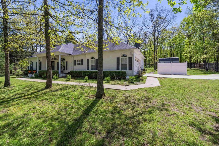 Enjoy country living just minutes from town. This 3 bedroom, 2 bath home sits on one acre and is tucked back off the road with a long driveway and mature trees welcoming you in. As you enter, you’ll notice beautiful hardwood floors and tall ceilings. The dining area is to the right and flows into the kitchen and great room, creating an open and functional layout. The kitchen is well appointed with black granite countertops, ample cabinetry, and a pantry. Just beyond the great room, French doors lead to a sunroom filled with windows overlooking the backyard and featuring a wood-burning fireplace—perfect for year-round enjoyment. The primary bedroom offers a comfortable retreat with a walk-in closet and en-suite bath. An additional office space could serve as a 4th bedroom, with a closet but no window. The garage includes a hobby room, and there is an additional storage room at the back of the home. You’ll also find a 12x20 shed with a roll-up door and solar lighting for even more storage. Call today for a showing!