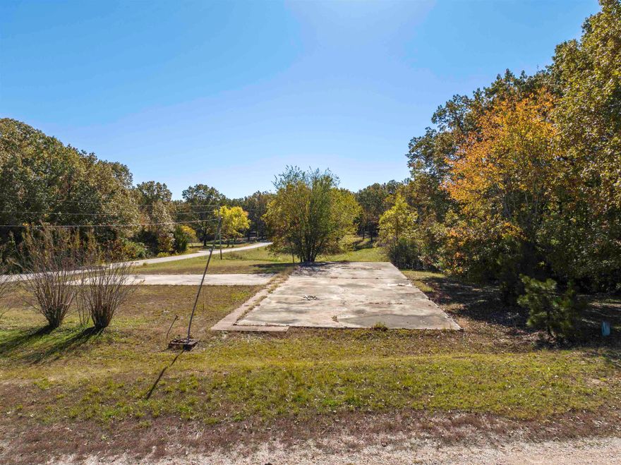 Commercial Vacant Land – Highland, Arkansas | .68± Acre | Sharp County  Prime commercial opportunity in the heart of Highland. This .68± acre parcel is mostly level and includes 2 large existing concrete slab previously used as the foundation for the Highland Fire Department. The Main slab measuring 117' wide and 36' deep is already plumbed for a bathroom, offering a head start for future development. The drive slab measures 30' X 60'.  Excellent visibility and easy access just off the main highway. The layout supports a wide range of business possibilities—ideal for storage units, RV Storage, personal shop, auto sales lot, service business, or other commercial ventures.  Key Features  .68± acre commercial lot Mostly flat terrain Large concrete slab in place w/ bathroom plumbing Former site of Highland Fire Department Strong location near major highway Flexible potential uses  Versatile location with solid infrastructure already in place. A smart build-ready spot in a growing commercial corridor.