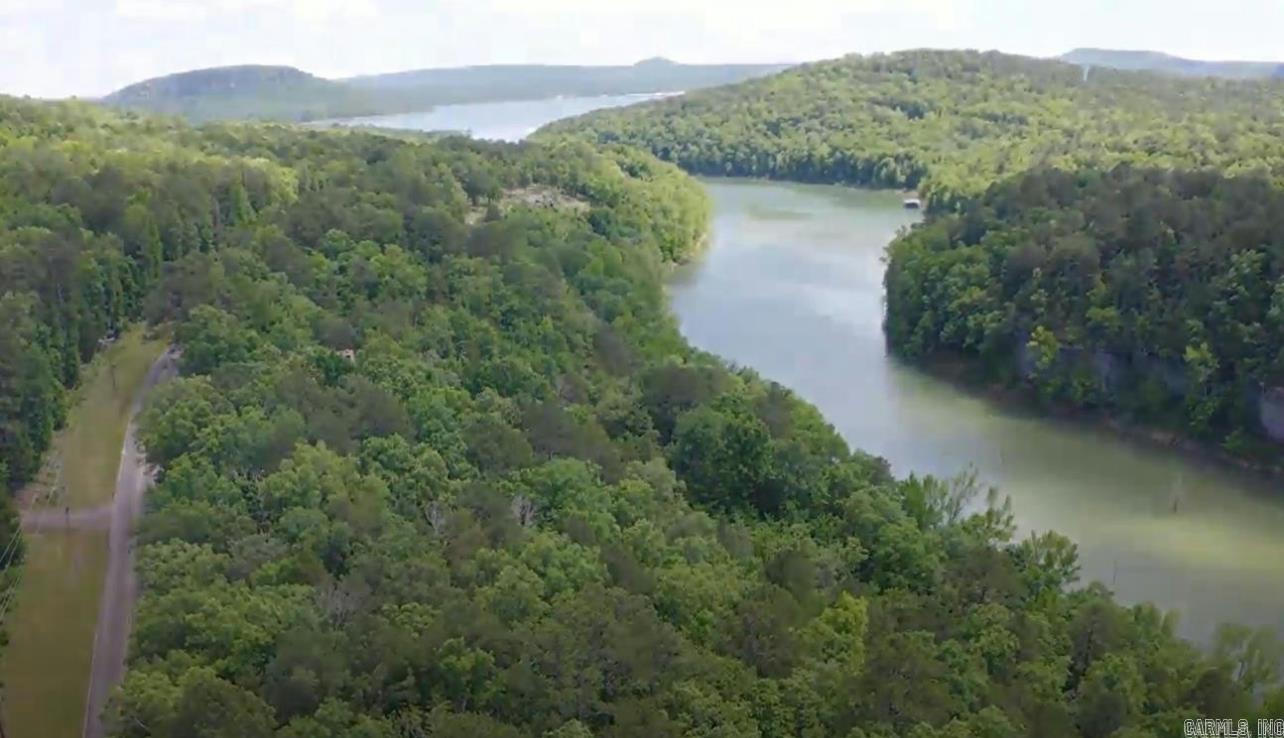 Great views can be achieved by clearing a path to the white line on this 1.15 acre (two lots) lake front property. Build your lake home on Greer's Ferry Lake at Party Cove aka Snakehead cove just outside the Fairfield Bay marina. Lynn Creek offers a boat ramp at the end of Teepee Trail just down from this property. Property is minutes from 92 miles of ATV trails, FFB marina, 2 golf courses, hiking trails, swimming pools, camp grounds, the town center, and much more. Come enjoy FFB and Greer's Ferry Lake!