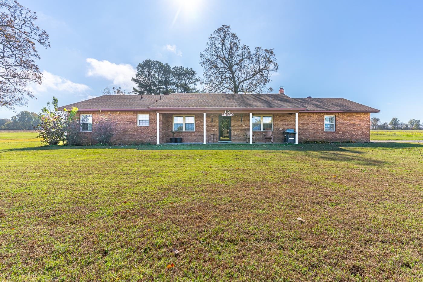 Welcome to Market 112 CR 330 of Pollard, AR. Situated on 2.48 +/- level acres sprinkled w/ fruit & shade trees is a completely renovated Ranch Rambler, wrapped in brick, topped w/ 2021 dimensional shingles, and accented by a covered front porch, back patio, and landscaping. The interior features 2,479 sf of well laid out living space that contains a living room, kitchen w/ bar seating, dining area, Master w/ ensuite w/ walk-in shower and dual walk-in closets, 3 guest bedrooms, guest bathroom w/ walk-in shower, and laundry rm. The exterior holds a wired & insulated 528 sf cabin w/ 16x24 lean-to, a 2000 sf floored & wired shop, and RV parking with 50 amp service & water. You'll love the tankless water heater, fiber internet, motion sensor security lights, aquifer hydrant, and living the country life, yet conveniently located a .25 mile off Hwy 139. Improvements to the property include: roof, hvac, water heater, remodeled bathroom,paint, flooring, fixtures, security lights & doors, 2 driveways graded w/ 140 ton of gravel, & survey. The Sellers love the deer, sunrises & sets, orchard & garden, pellet stove, and being the only house on the road. Call today to make this house your home.